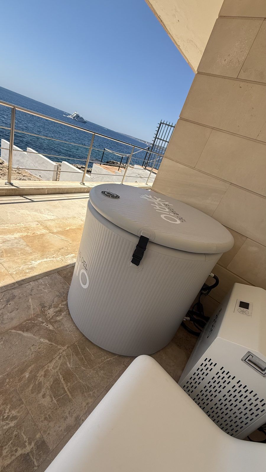 Home cold plunge with chiller on a seafront terrace